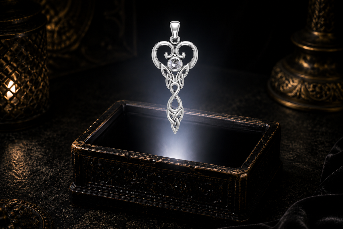 Aries white gold Celtic Zodiac Goddess pendant with white cubic zirconia hovering above a glowing antique jewelry coffer