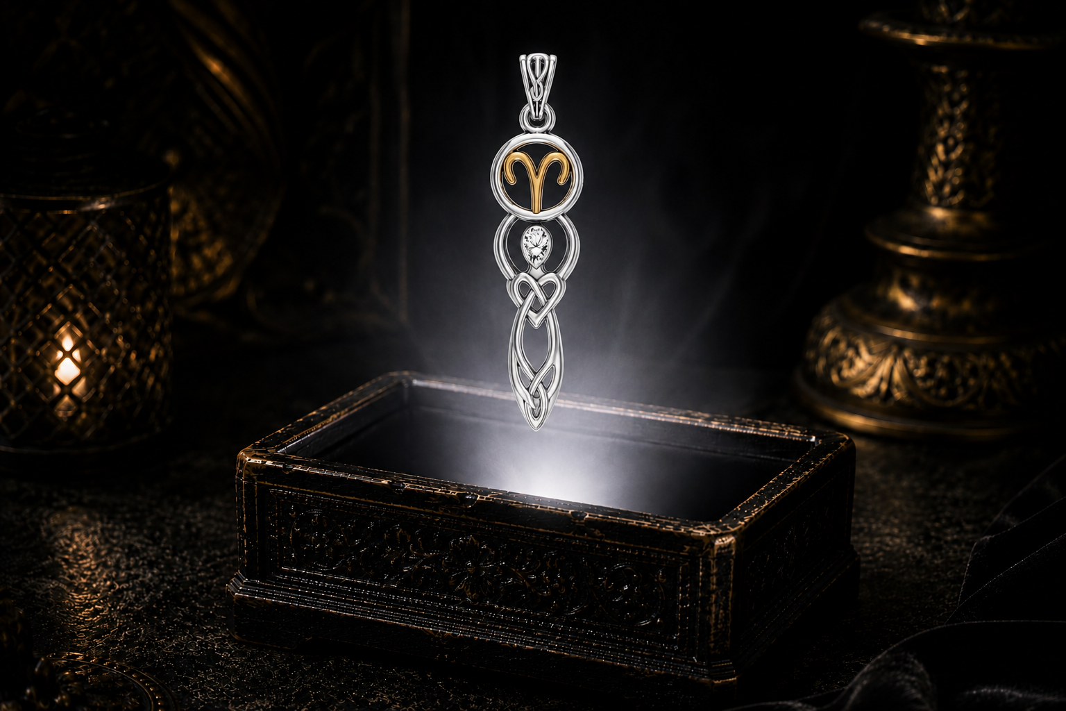 Sterling silver Aries birthstone pendant with natural white topaz, gold accents, and Celtic goddess symbolism showcased above an antique jewelry box surrounded by mystical light and shadow.