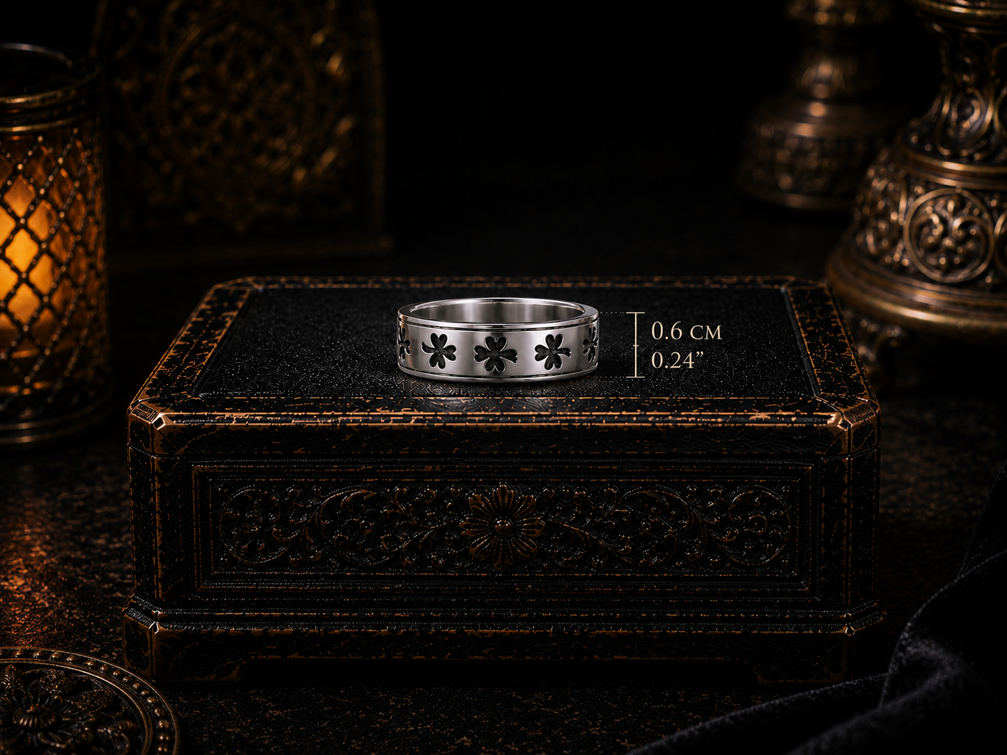 Sterling silver Celtic shamrock band ring hovering above an illuminated antique black coffer in a dark cinematic luxury setting.