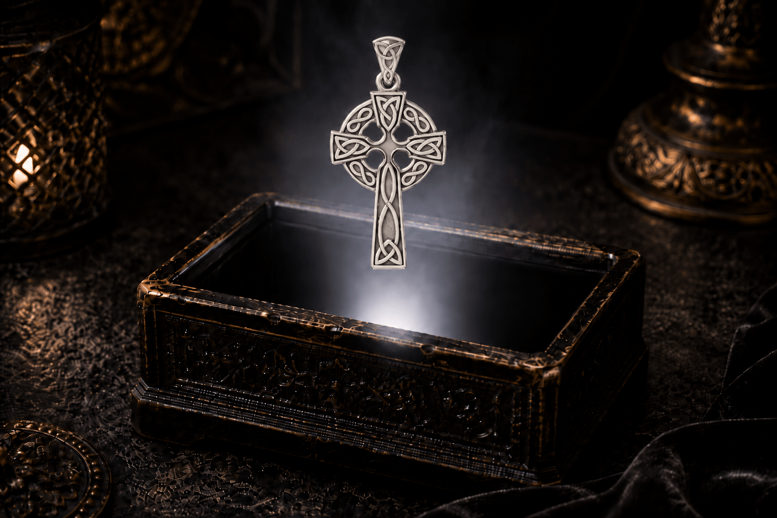 White gold Celtic cross pendant with a circular ring, interlaced Celtic knot design and matching knot-detailed bale hovering above an ornate jewelry box.
