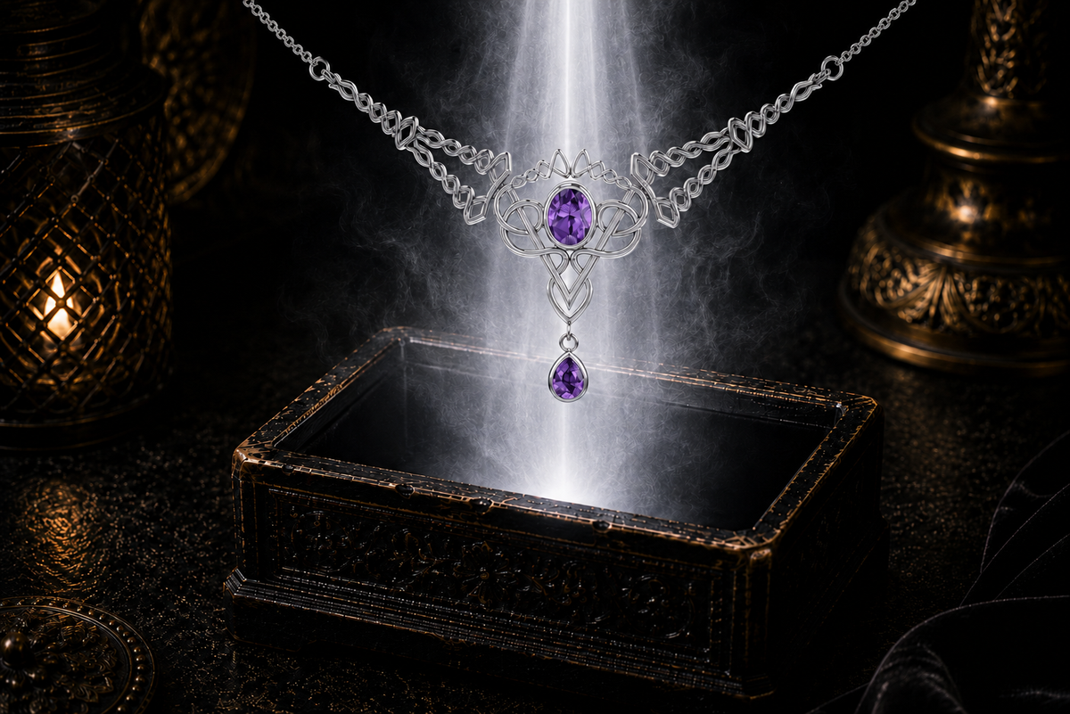 Sterling silver Celtic filigree twist necklace with amethyst gemstones floating above an ornate jewelry box beneath luminous light in a dark luxury setting.