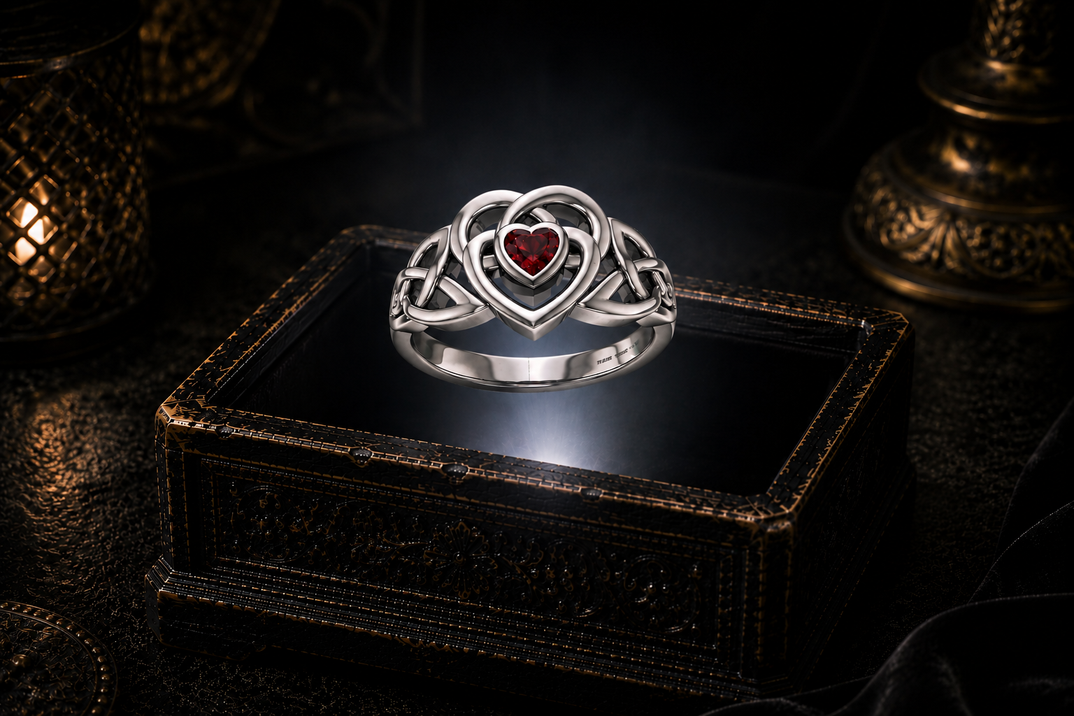 Celtic heart sterling silver ring with deep red garnet gemstone floating above illuminated antique jewelry box in dark cinematic luxury setting