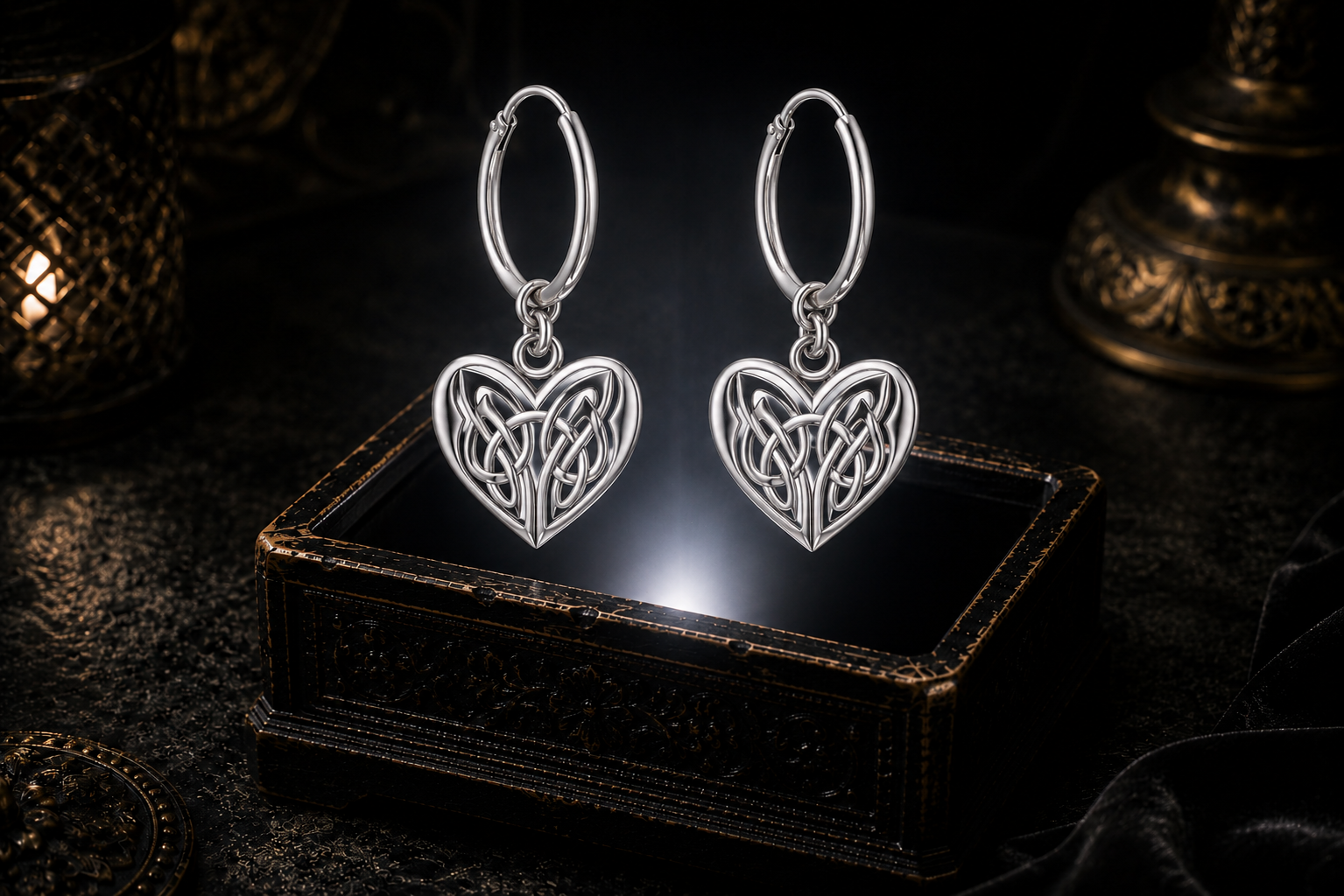 Sterling silver Celtic heart knot hoop earrings floating above a glowing ornate jewelry box in a dark luxurious mystical setting with cinematic lighting
