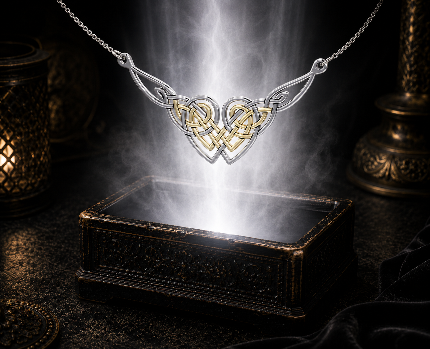 Sterling silver Celtic heart knot necklace with 14K gold accents floating above an ornate jewelry box surrounded by soft glowing light in a dark luxury setting.