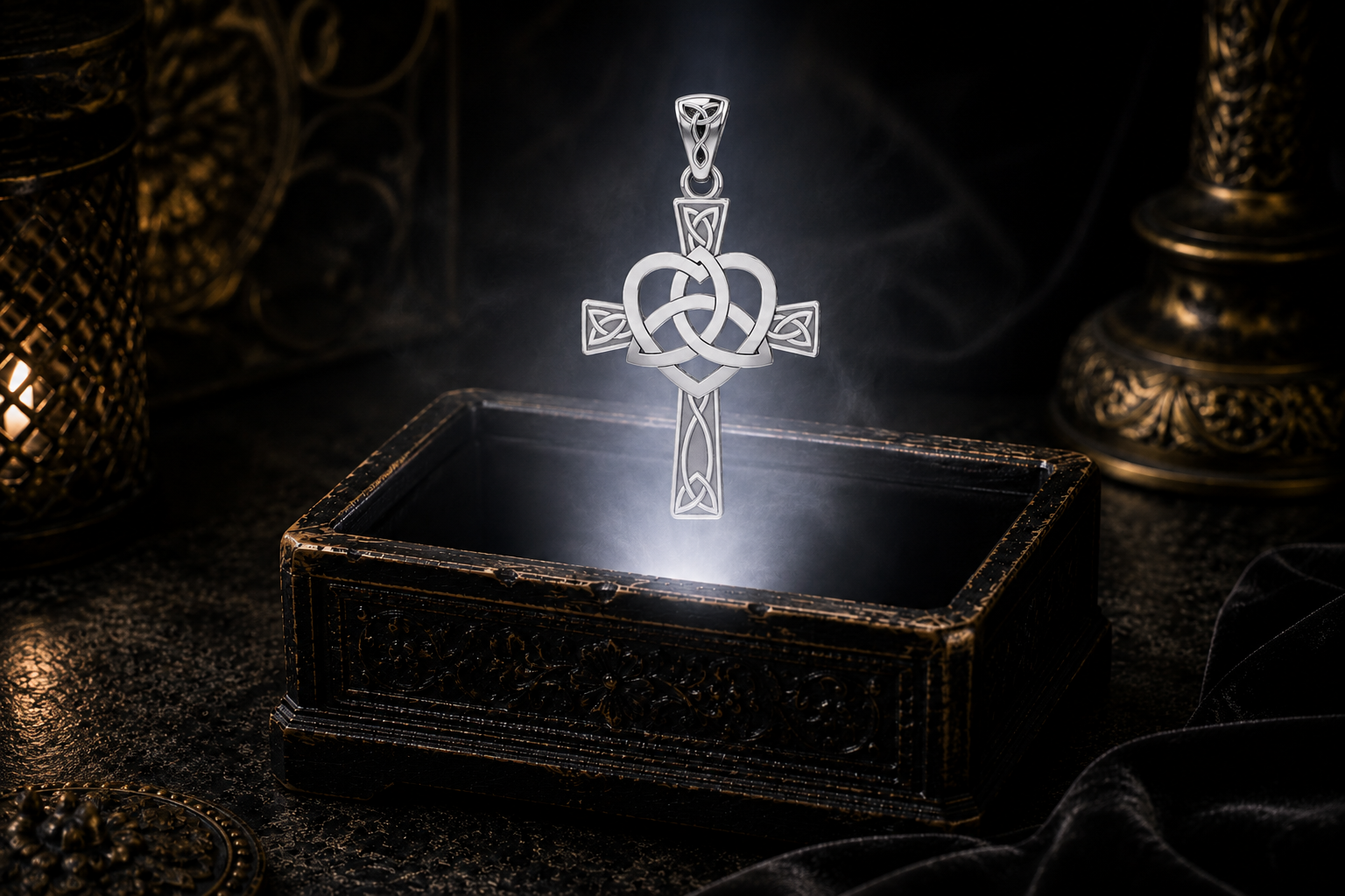 Solid White Gold Celtic Heart Trinity Knot Cross pendant floating above an ornate jewelry box in a refined dark luxury setting with warm candlelight, cinematic lighting, and a soft mystical atmosphere. An interwoven Trinity Knot forms a heart at the center of the cross, while intricate Celtic knotwork adorns each arm.