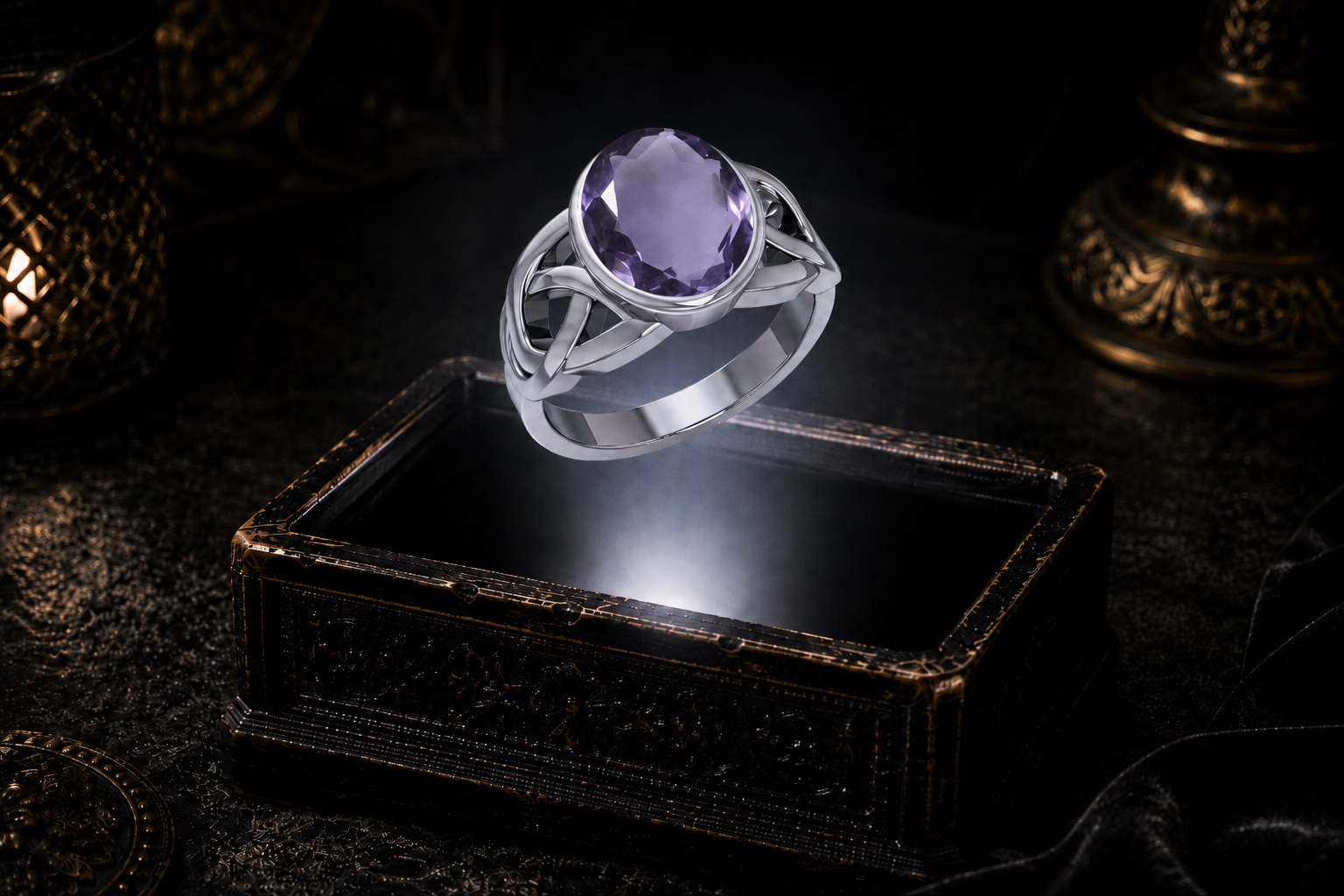 Sterling silver Celtic knot ring with oval sapphire centerpiece suspended within a neutral white beam above an ornate jewelry chest