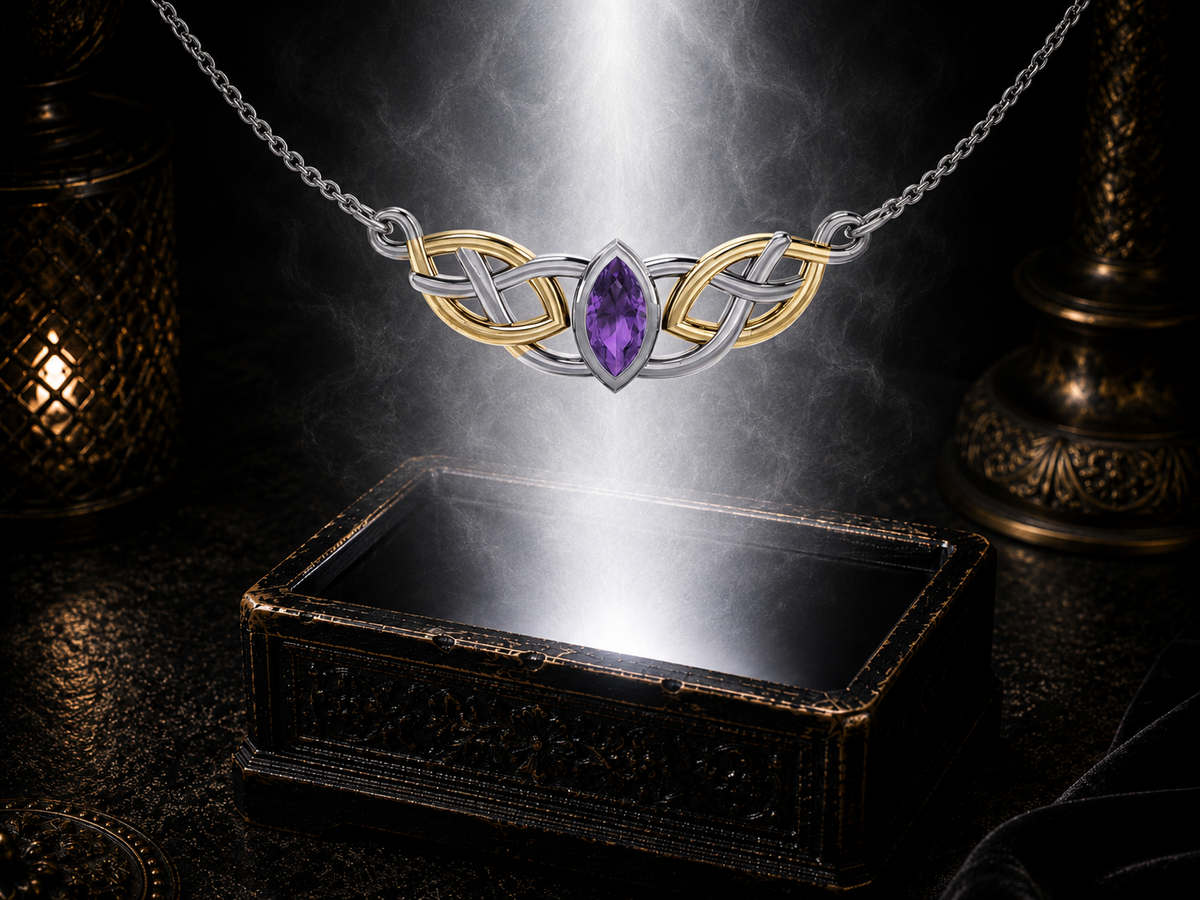 Sterling silver Celtic knotwork necklace with 14K gold accents and amethyst gemstone floating above an ornate jewelry box surrounded by soft glowing light in a dark luxury setting.