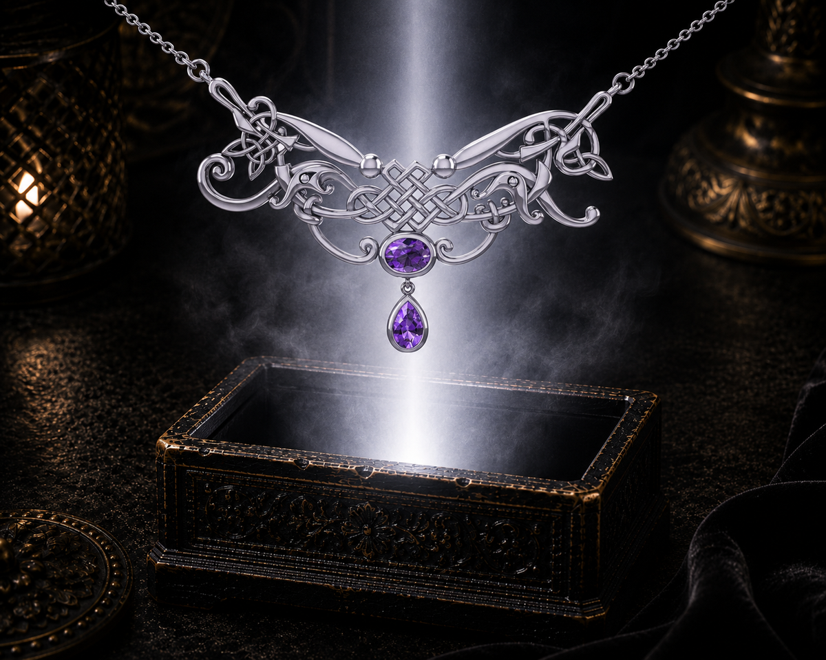 Sterling silver Celtic knotwork filigree necklace with amethyst gemstones floating above an ornate jewelry box illuminated by soft radiant light in a dark luxury setting.