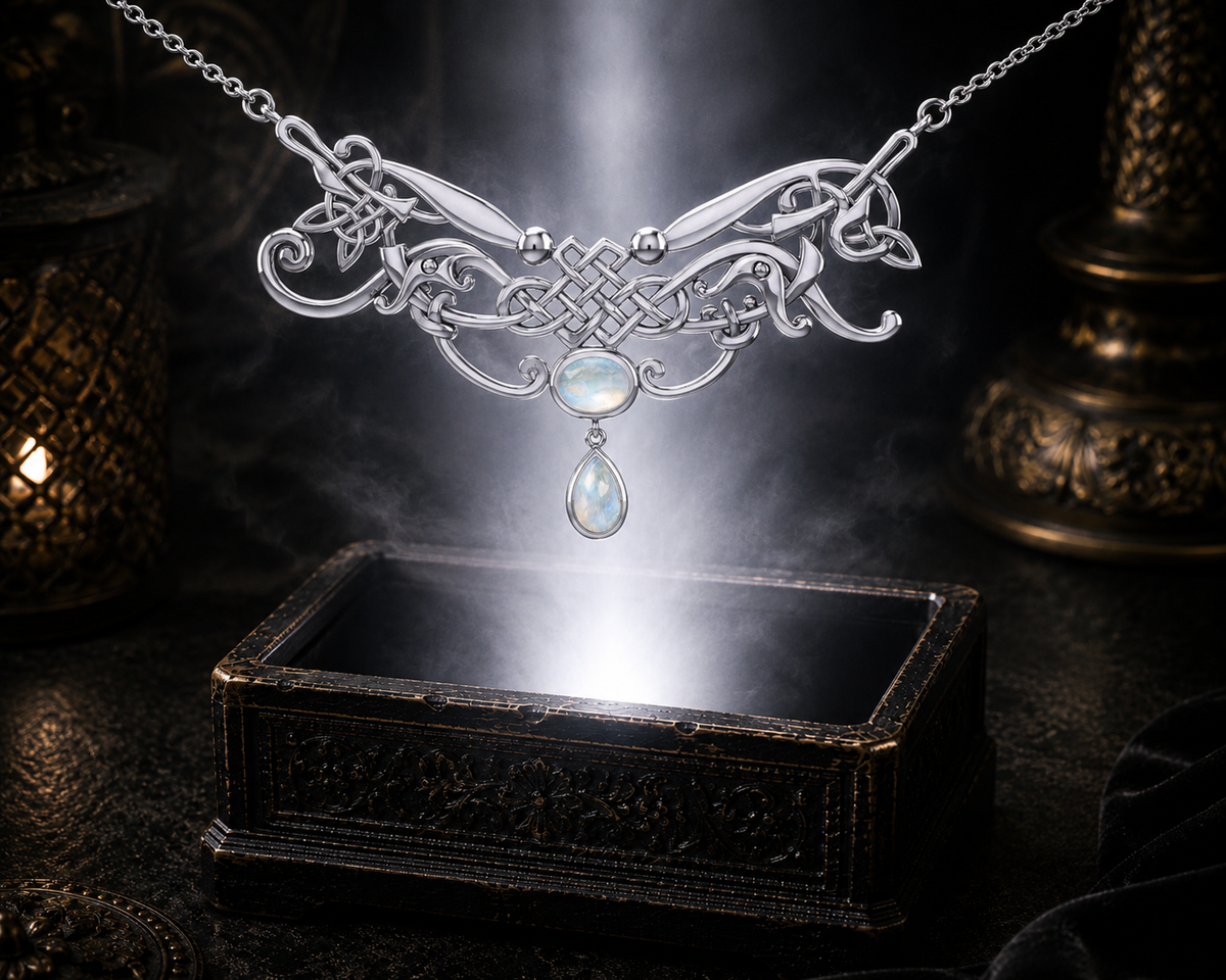 Sterling silver Celtic knotwork filigree necklace with rainbow moonstone gemstones displayed above a luminous jewelry chest surrounded by ethereal glow in a cinematic luxury setting.