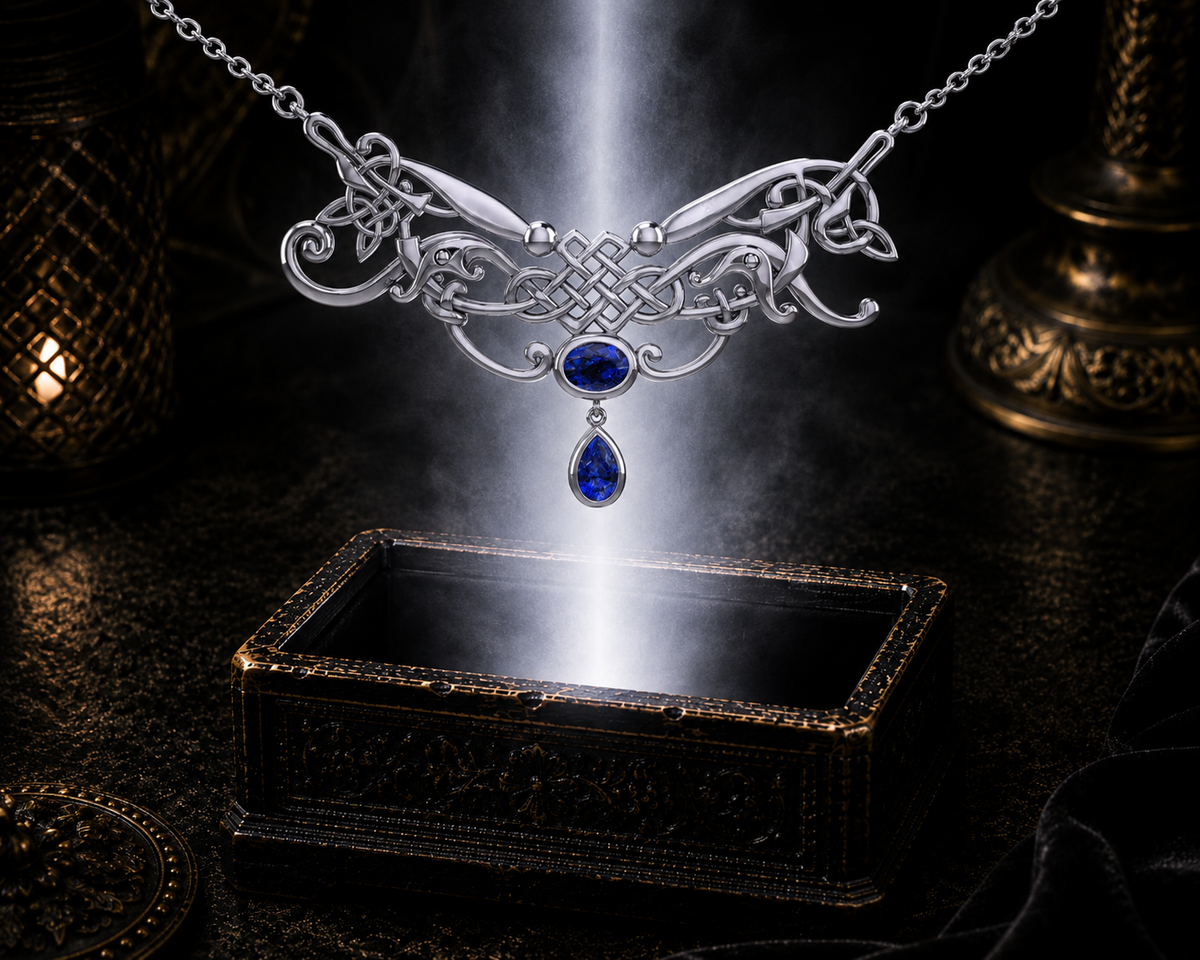 Sterling silver Celtic knotwork filigree necklace with sapphire gemstones floating above an ornate dark jewelry box beneath dramatic beams of light in a refined luxury environment.