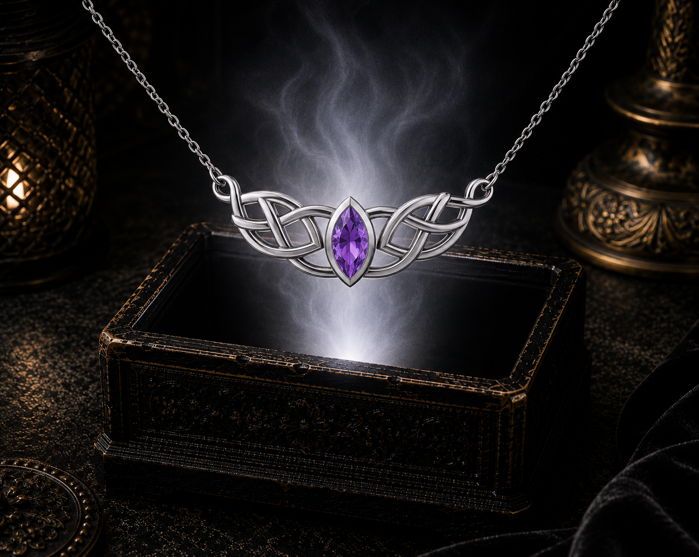 Sterling silver Celtic knot necklace with blue topaz gemstone illuminated above an ornate jewelry chest surrounded by soft glowing light
