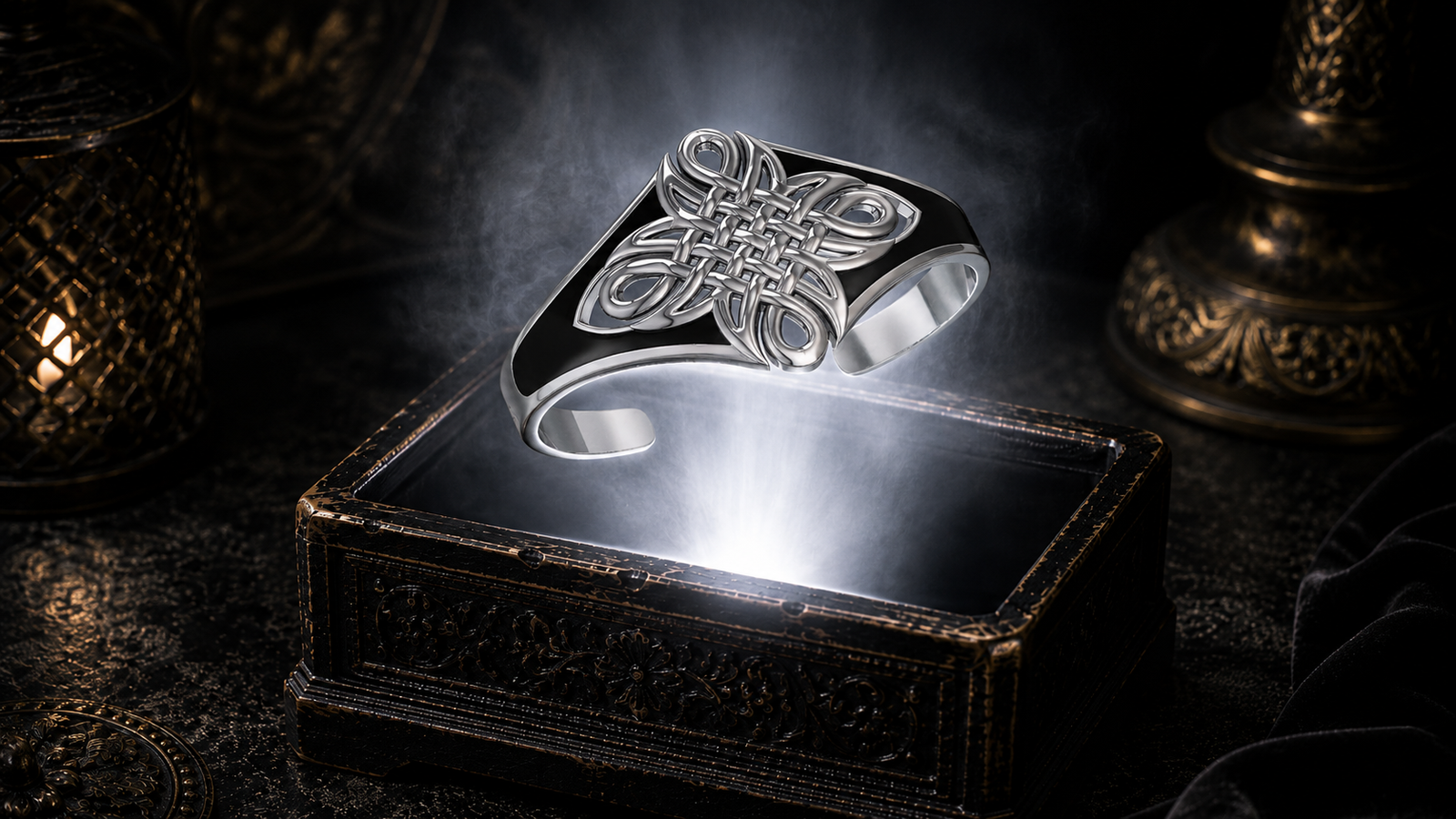 Sterling silver Celtic Maori fusion cuff bracelet with intricate tribal knotwork floating above an ornate jewelry box illuminated by soft white light in a dark luxury setting with cinematic atmosphere and heritage-inspired elegance.
