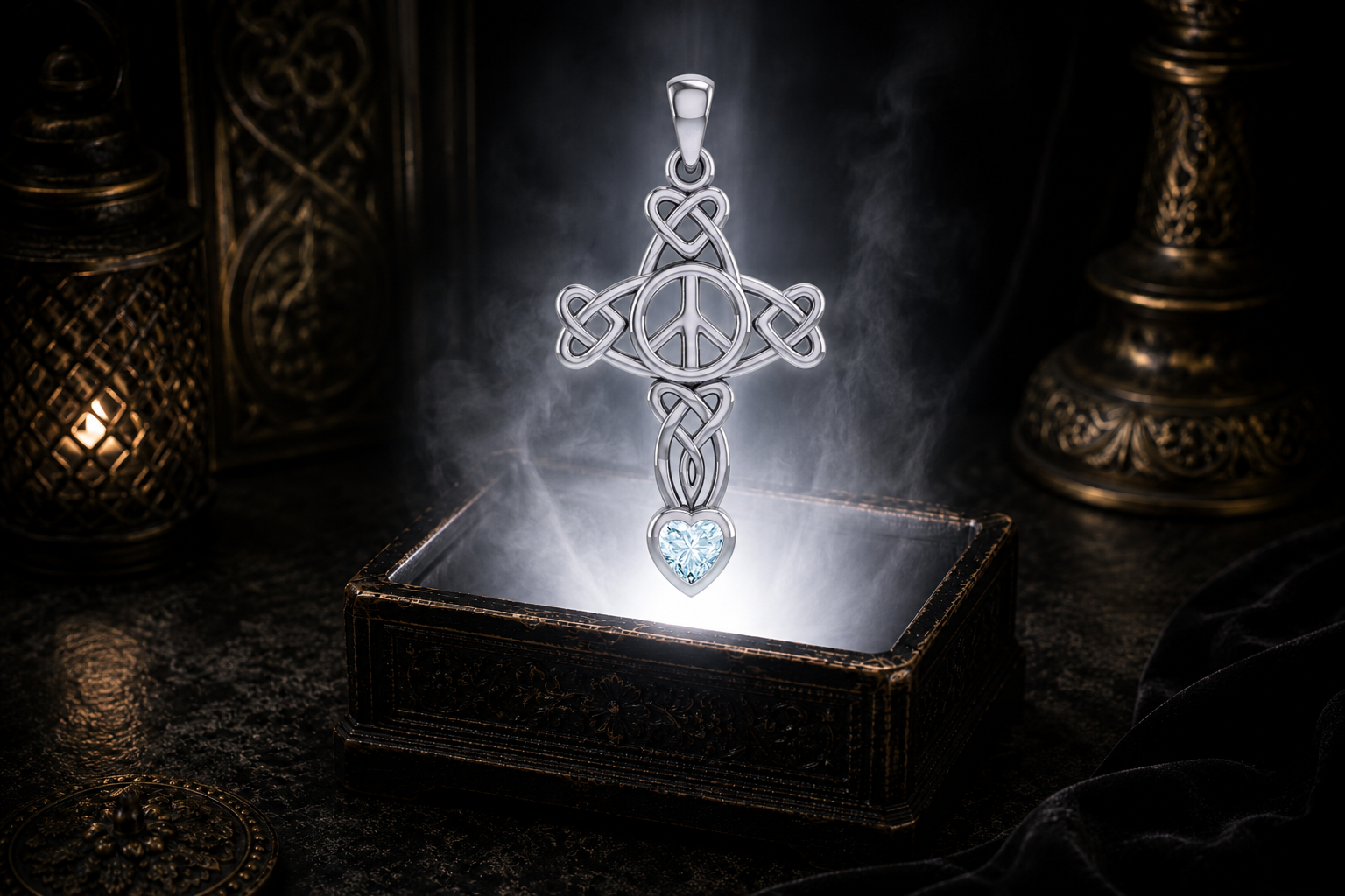 Sterling silver Celtic Peace Cross pendant with heart knotwork and garnet heart gemstone floating above an ornate black jewelry box illuminated by soft white light in a dark luxurious setting with candlelit Celtic decor.