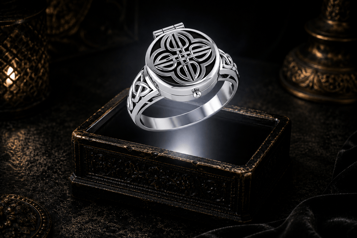 Celtic poison ring suspended above an ornate jewelry box in a neutral white beam of light
