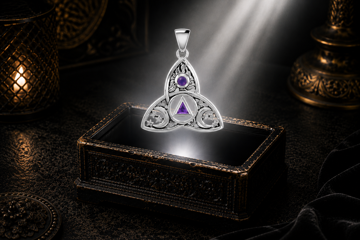 White gold Celtic Trinity Knot Sun Moon and Stars pendant with amethyst gemstone suspended above an elegant jewelry chest surrounded by mystical light in a refined luxury celestial environment.