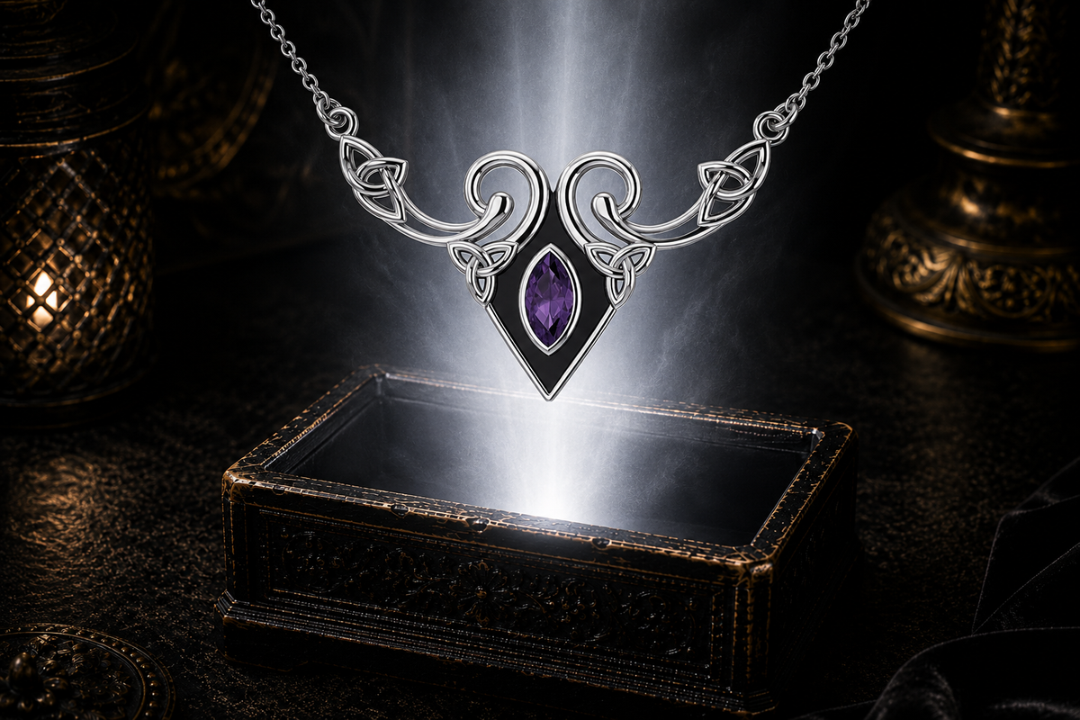 Sterling silver Celtic Triquetra necklace with amethyst gemstone floating above an ornate jewelry box beneath luminous light in a dark luxury setting with elegant reflections.