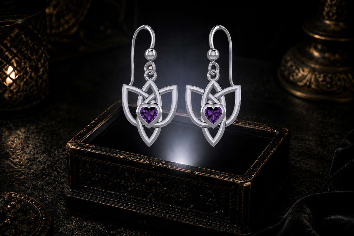Sterling silver Celtic Triquetra Trinity Knot heart earrings with amethyst heart gemstones floating above a glowing ornate jewelry box in a dark luxurious mystical setting with cinematic lighting
