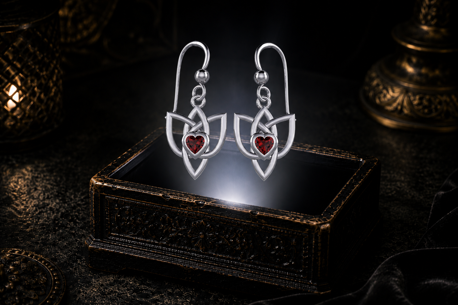 Sterling silver Celtic Triquetra Trinity Knot heart earrings with garnet heart gemstones floating above a glowing ornate jewelry box in a dark luxurious mystical setting with cinematic lighting