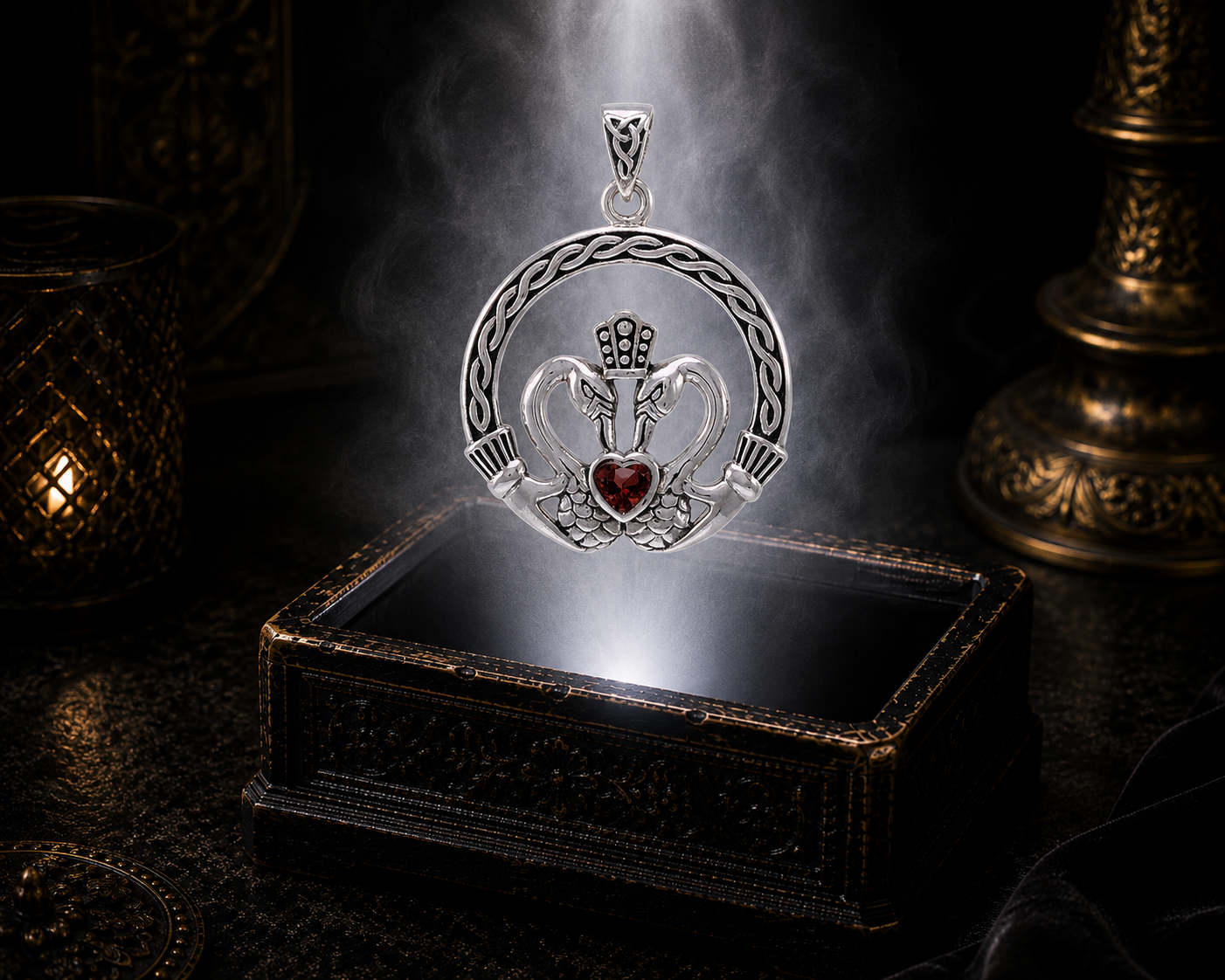 Sterling silver Claddagh swan heart pendant with amethyst gemstone floating above an ornate antique jewelry box illuminated by soft white light in a cinematic luxury environment.