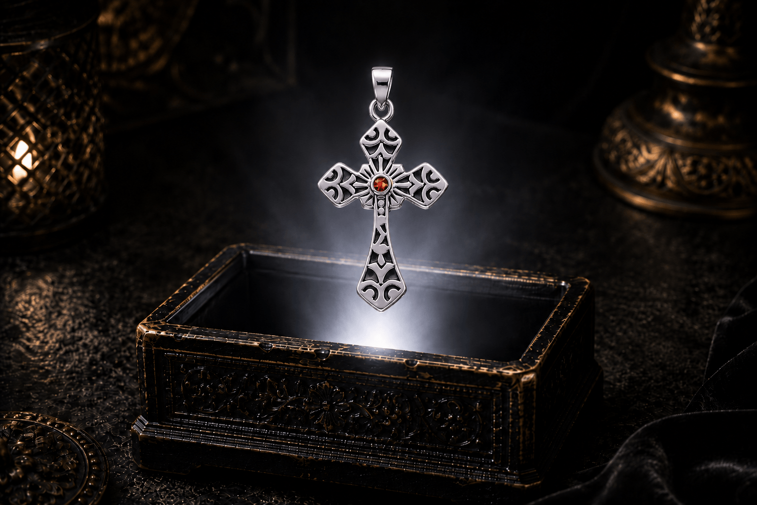 Sterling silver Gothic cross pendant with a Garnet gemstone hovering above an ornate antique jewelry box