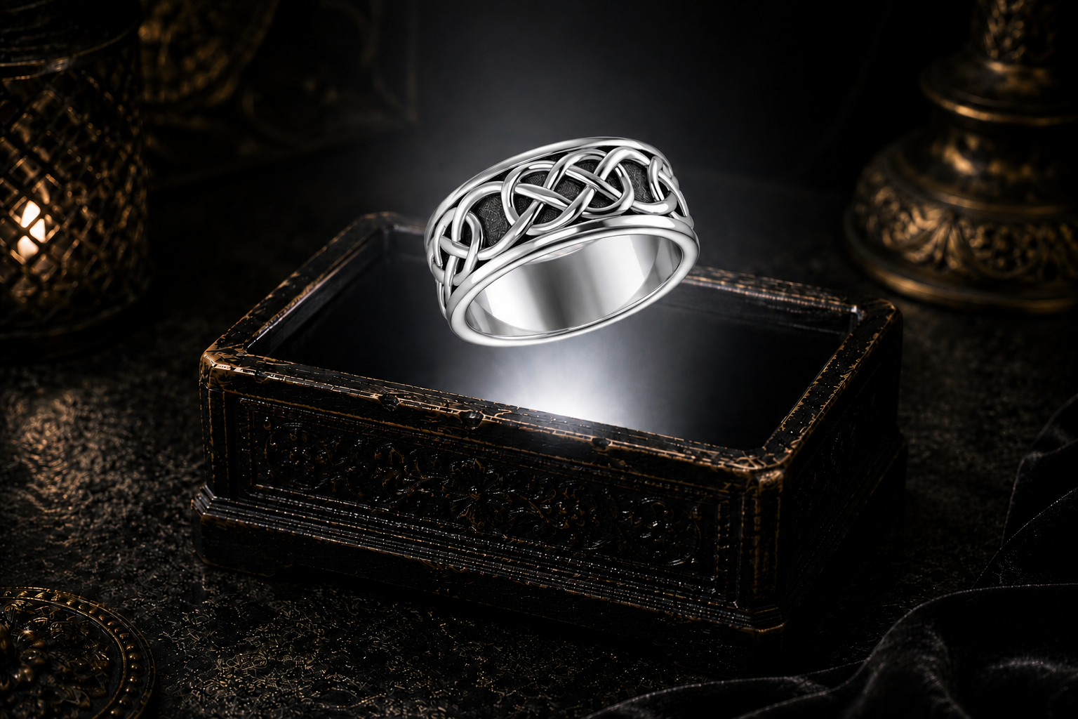 Sterling silver endless Celtic knot band with raised knotwork and an oxidized recessed background suspended above an antique jewelry box in a beam of mysterious white light within a refined luxury setting.