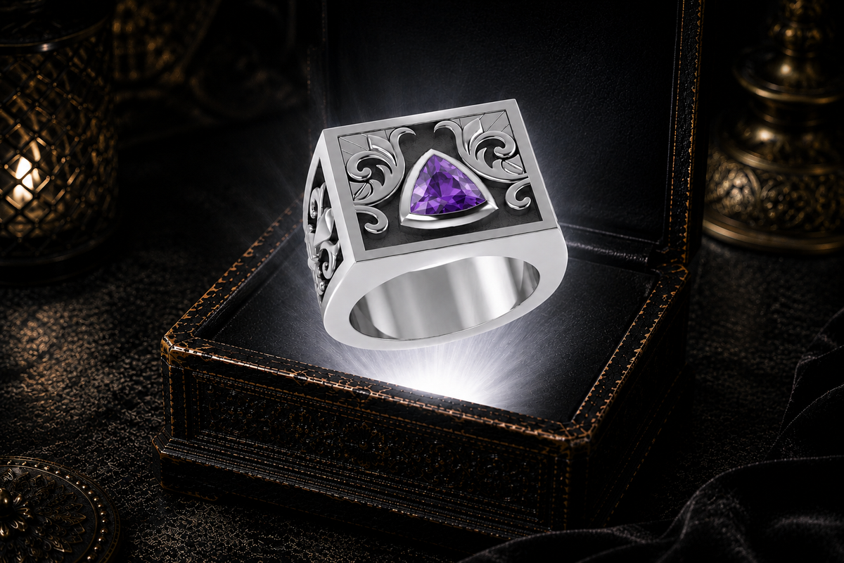 Fleur de Lis sobriety ring in sterling silver with amethyst gemstone illuminated above an antique jewelry box with mystical gothic lighting