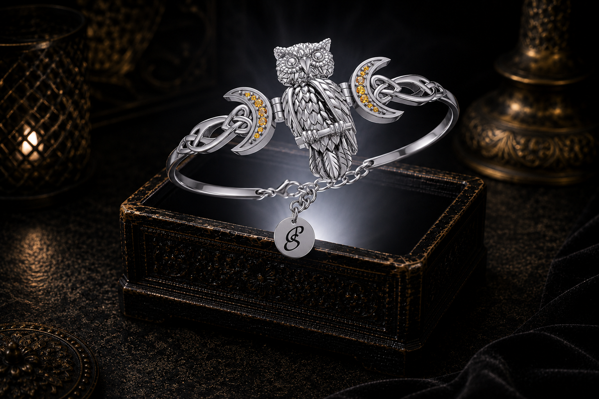 Great Horned Moonlit Owl sterling silver cuff bracelet with citrine gemstones set within crescent moons, floating above an ornate jewelry box illuminated by soft white light in a dark luxury setting with Celtic knotwork, mystical symbolism, and cinematic elegance.