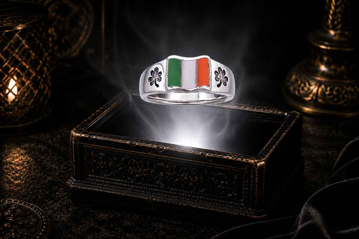 Sterling silver Irish flag shamrock ring with green, white, and orange enamel floating above an ornate antique jewelry box in a refined dark luxury setting with warm candlelight, cinematic lighting, a pure white light beam, and a mystical atmosphere.