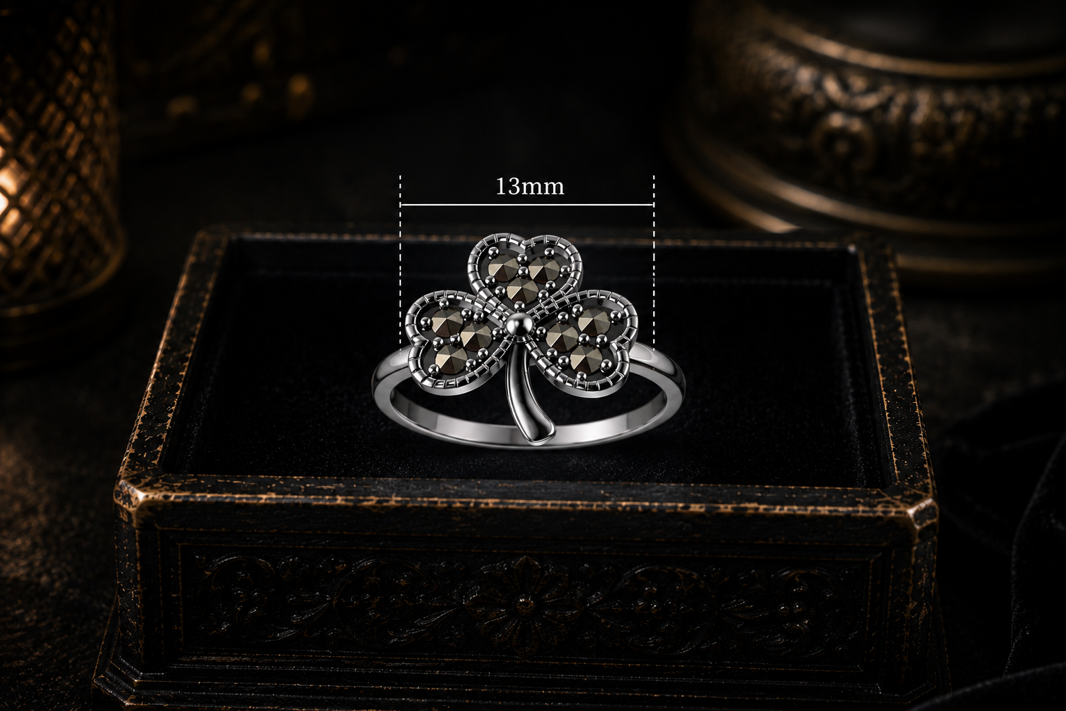 Lucky sterling silver Celtic shamrock ring with marcasite floating above an illuminated antique jewelry box in a dark mystical Celtic setting