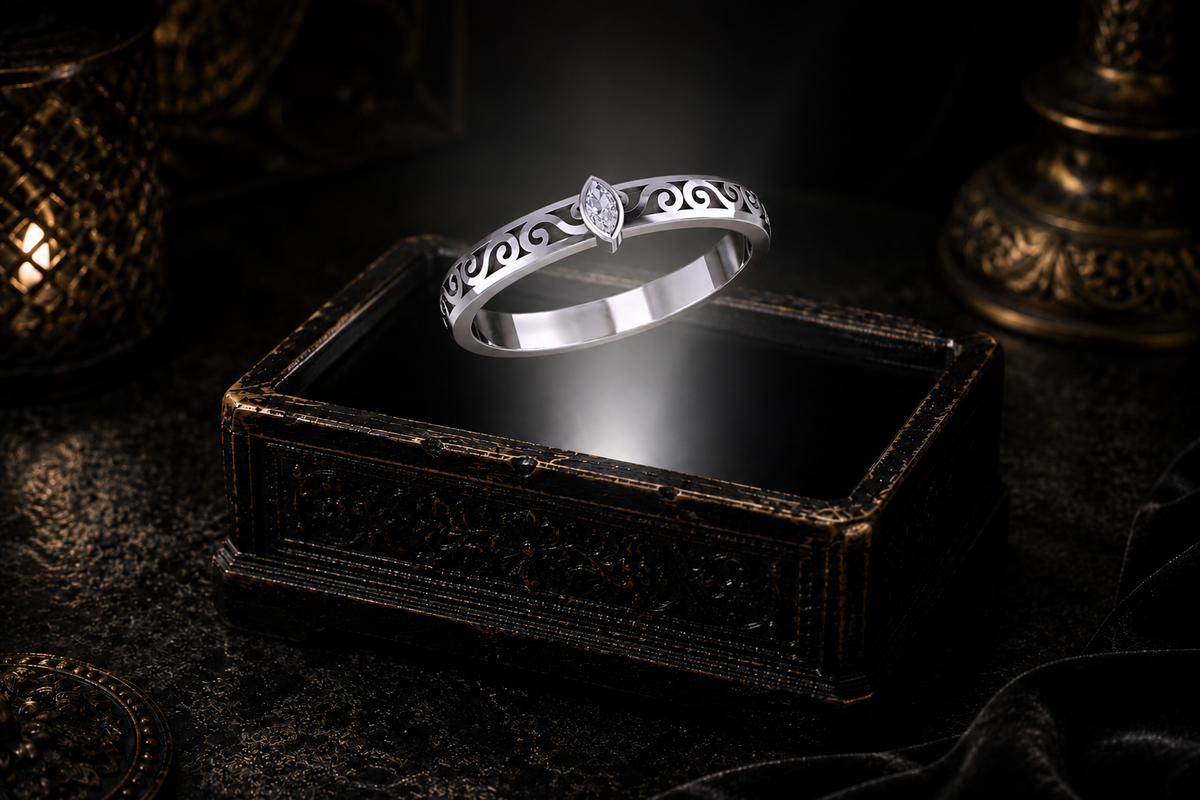 Cubic zirconia marquise sterling silver ring with openwork scrolls showcased over an antique jewelry box against a dark luxury background.