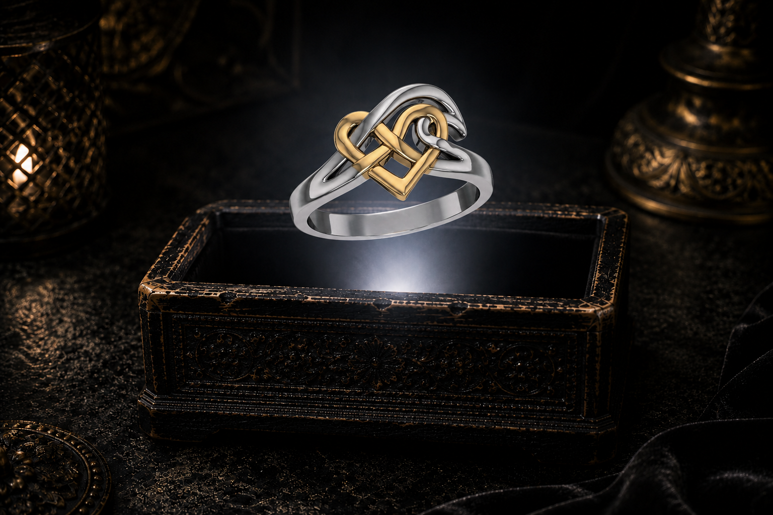 Sterling silver Celtic ocean wave heart ring with 14K gold accent floating above a glowing antique jewelry box in a cinematic luxury setting