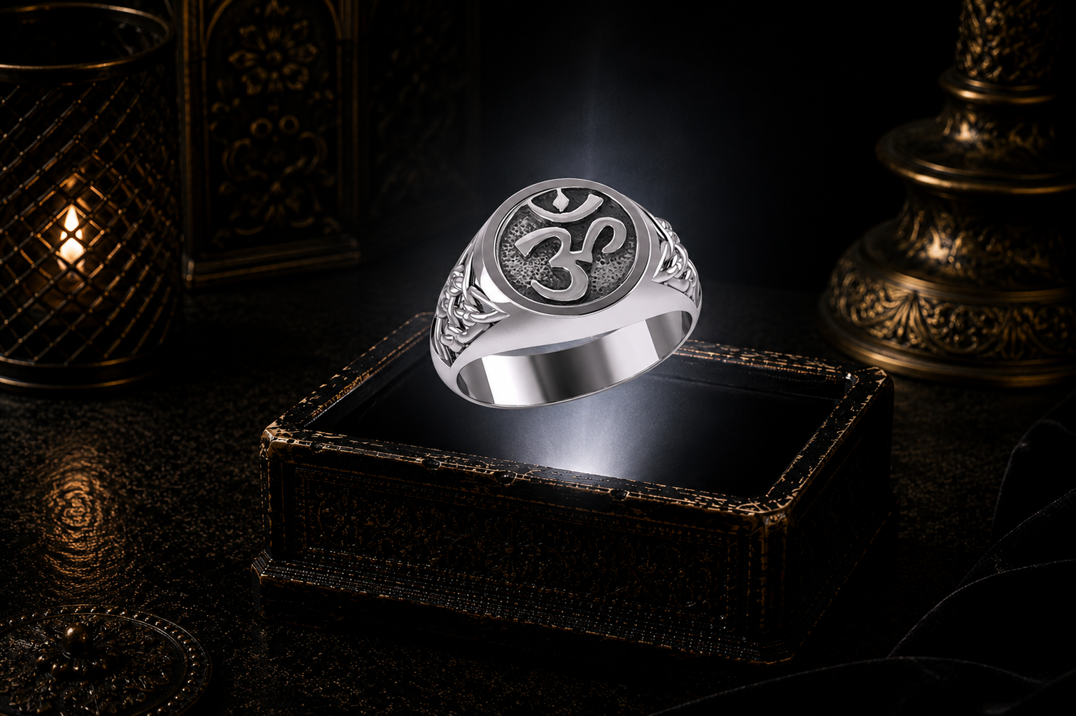 Sterling silver Om symbol Celtic knotwork ring floating above a glowing antique jewelry box in a cinematic luxury setting