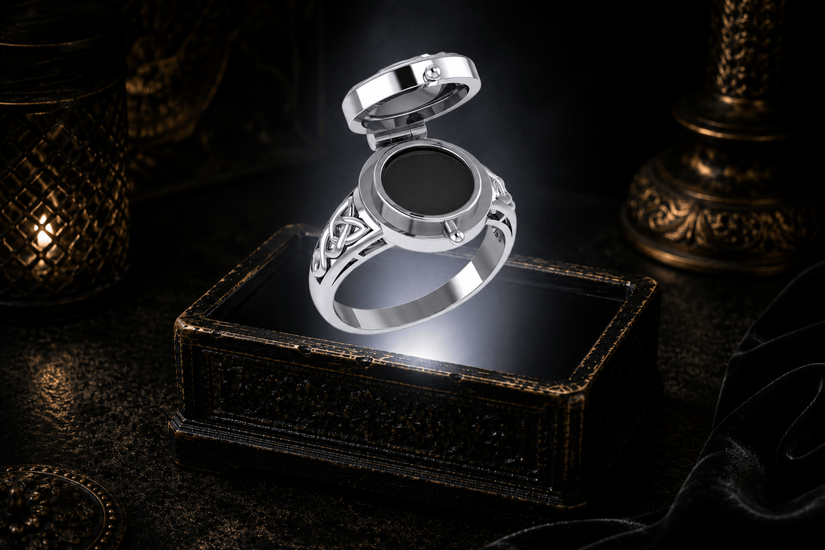 Open sterling silver poison ring showing the circular hidden compartment beneath its hinged lid