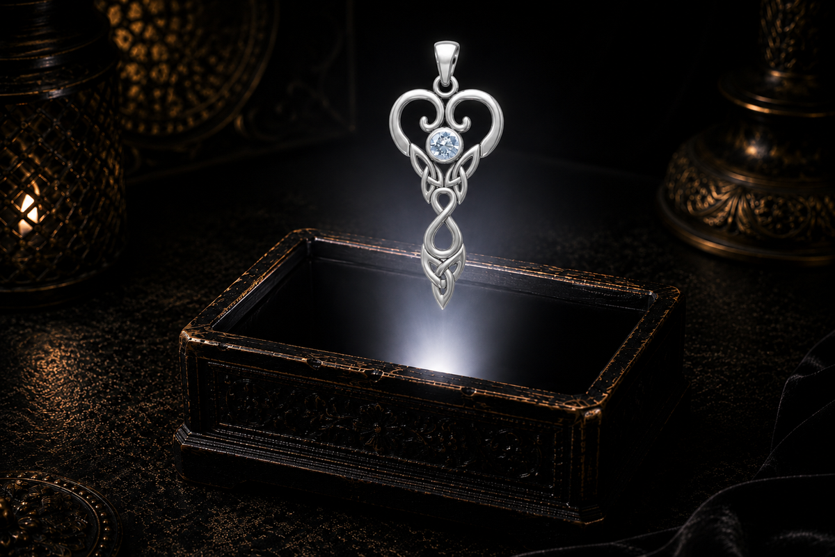 Pisces white gold Celtic pendant with genuine aquamarine hovering above an illuminated jewelry coffer in a luxury setting