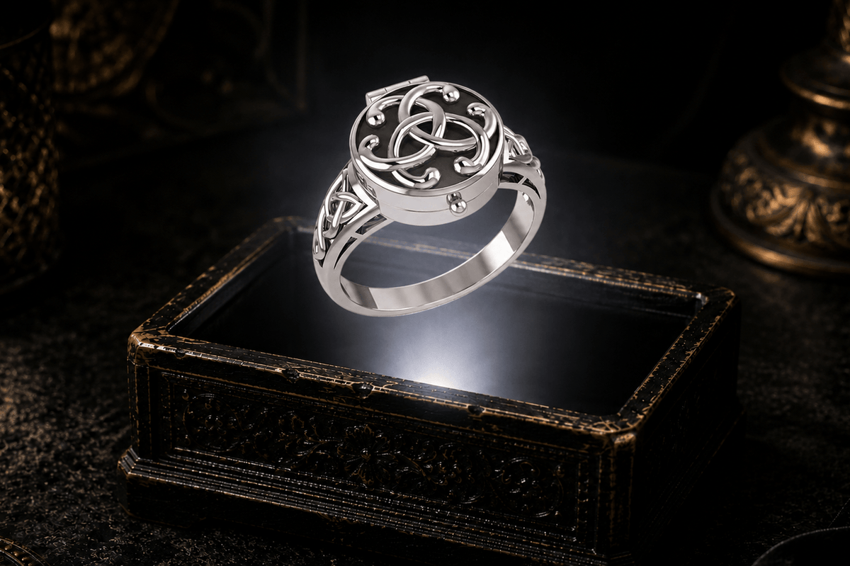 Closed poison ring in sterling silver showing its hinged lid and concealed inner compartment. Celtic knotwork