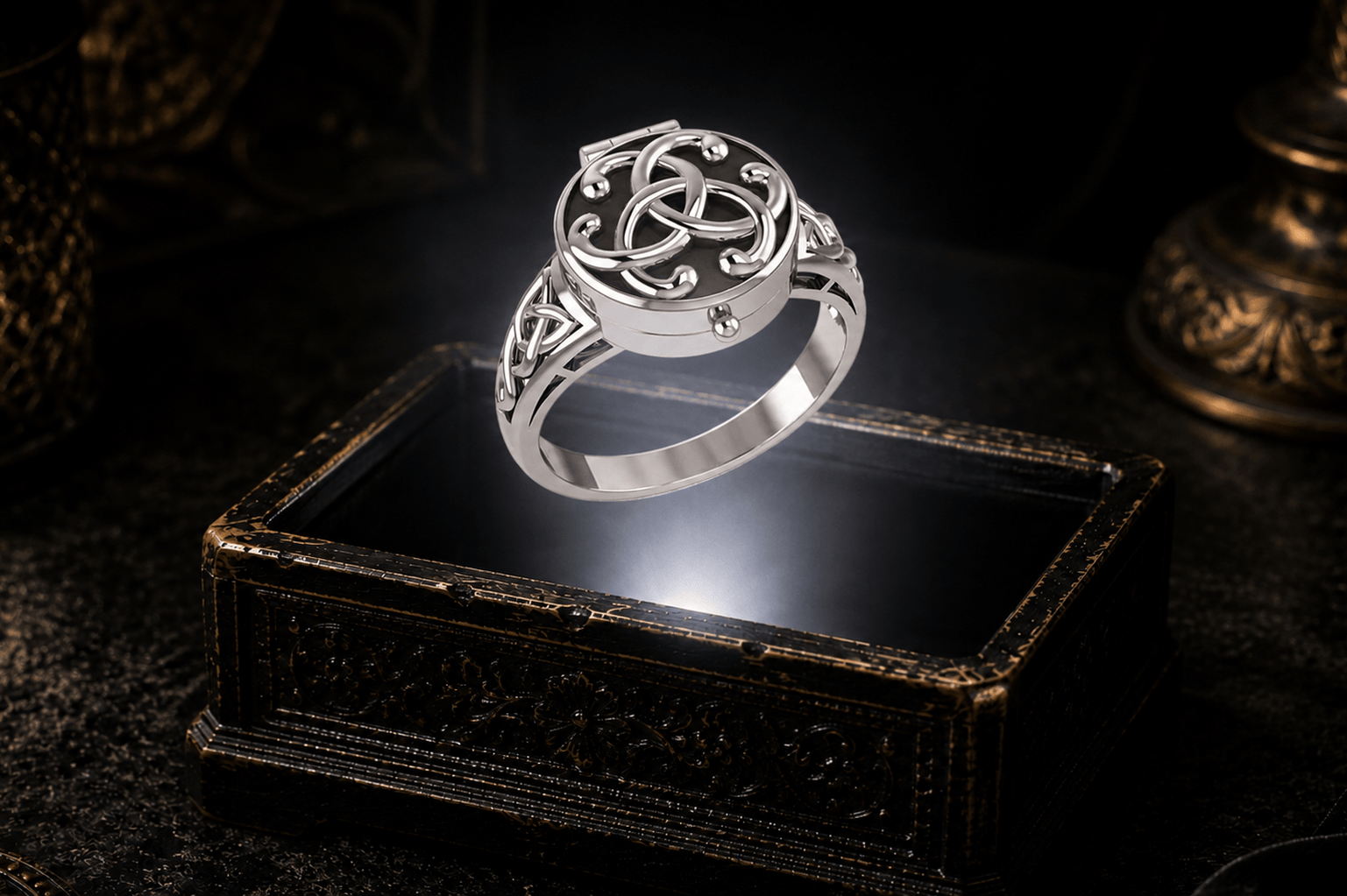 Closed poison ring in sterling silver showing its hinged lid and concealed inner compartment. Celtic knotwork