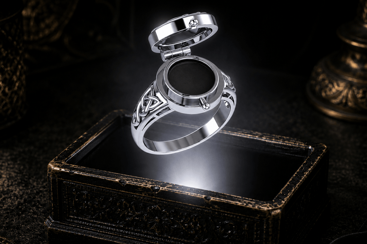 Poison ring in sterling silver showing its hinged lid and concealed inner compartment celtic knots