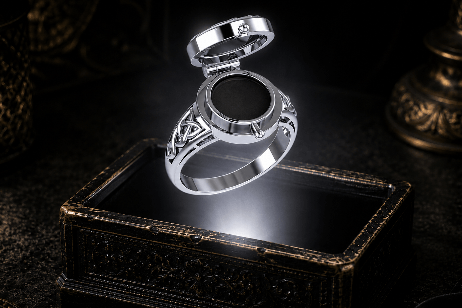 Closed poison ring in sterling silver showing its hinged lid and concealed inner compartment. Celtic knotwork