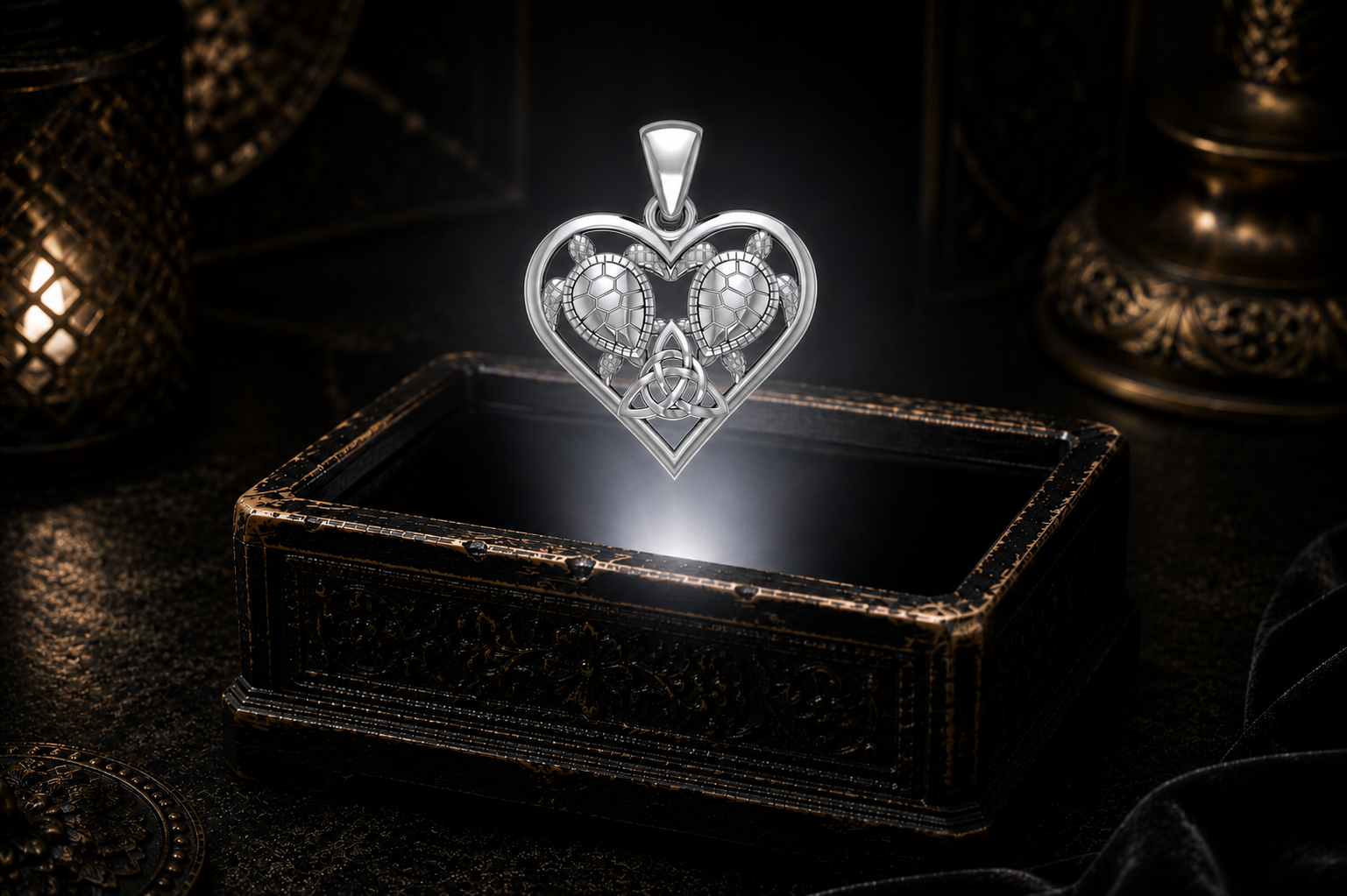 White gold sea turtle Trinity Knot pendant floating over an ornate keepsake box with warm ambient lighting and a cinematic dark backdrop.