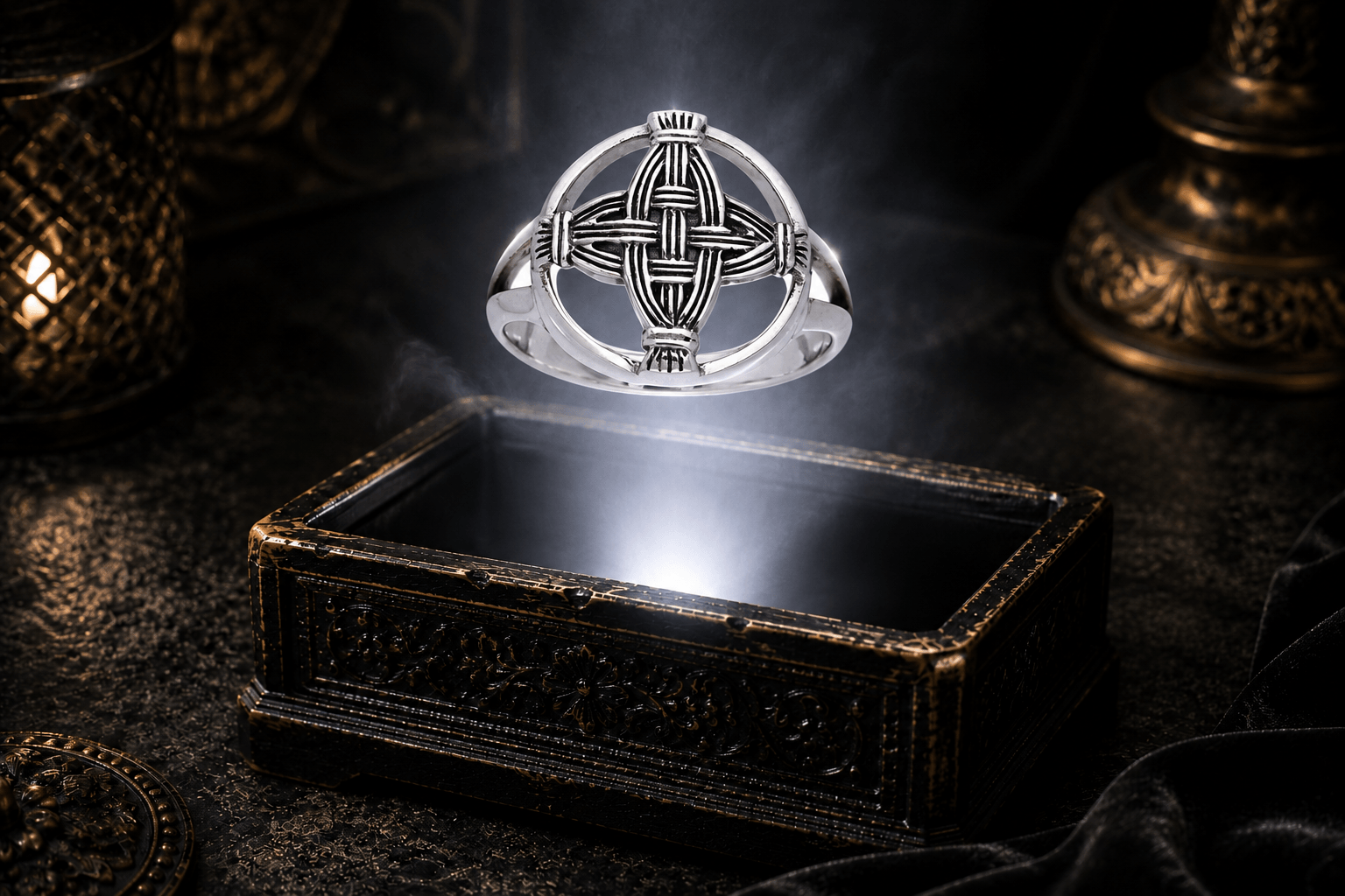 Sterling silver St. Brigid’s Cross ring with woven openwork arms hovering above an antique jewelry box in a neutral white beam of light.