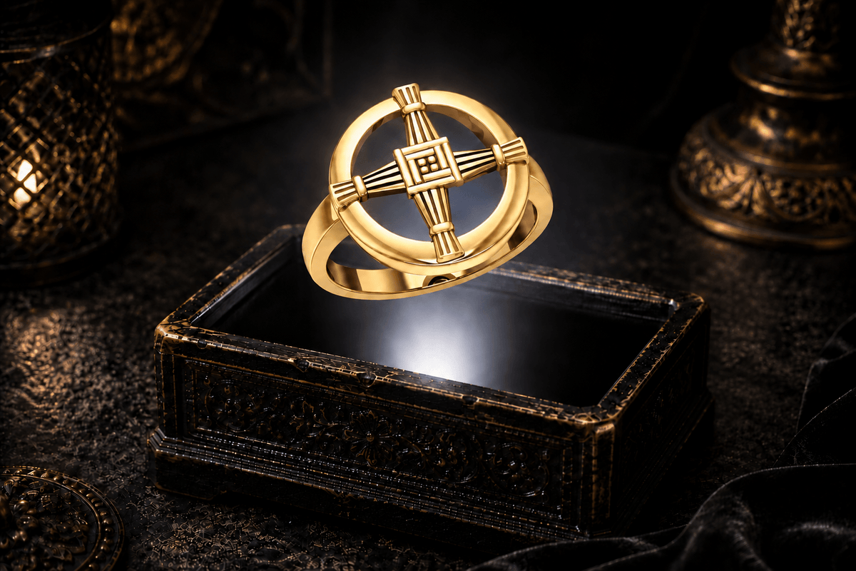 Gold St. Brigid’s cross ring suspended above an ornate jewelry box, with white light beneath the band and fine recessed lines across the cross.