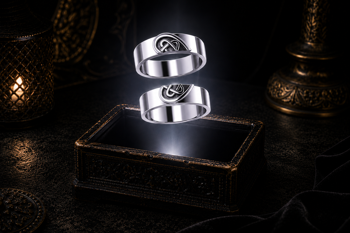 Sterling silver Celtic lovers knot couple rings floating separately above a dark ornate jewelry box with dramatic mystical lighting