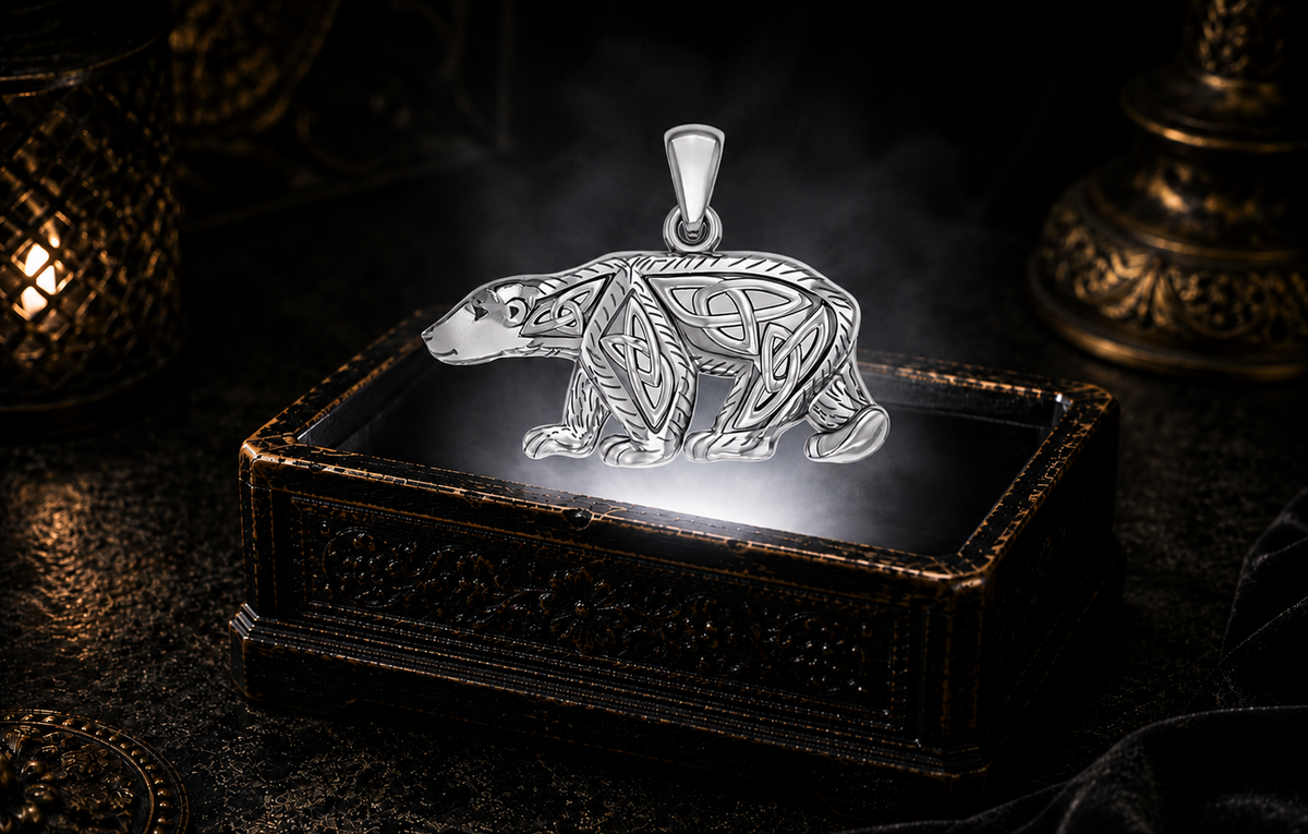 Sterling silver Celtic Polar Bear pendant with Trinity Knot and Triquetra openwork floating above an antique black jewelry box with a pure white glowing light beam, soft fog, candlelit shadows, and dark luxury scenery.