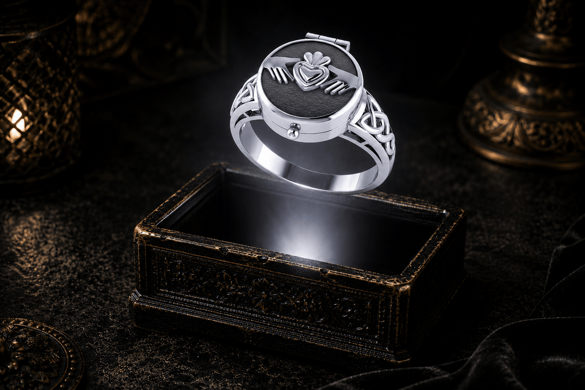 Closed Poison Ring in Sterling Silver with Claddagh design showing its concealed compartment and Celtic knotwork band over an ornate keepsake box in a dark cinematic setting