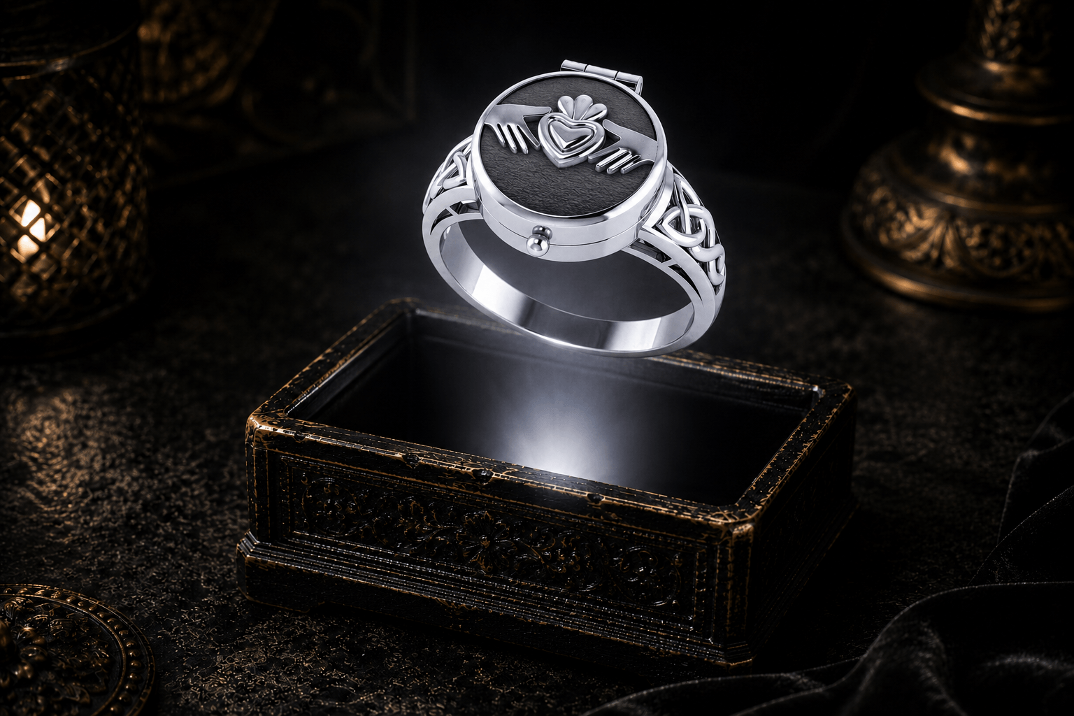 Closed Poison Ring in Sterling Silver with Claddagh design showing its concealed compartment and Celtic knotwork band over an ornate keepsake box in a dark cinematic setting