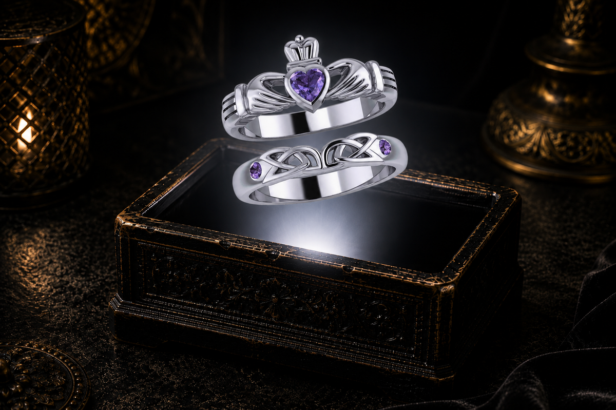 Sterling silver Claddagh ring set with Genuine Amethyst gemstones suspended above an ornate keepsake box in a dramatic luxury setting.
