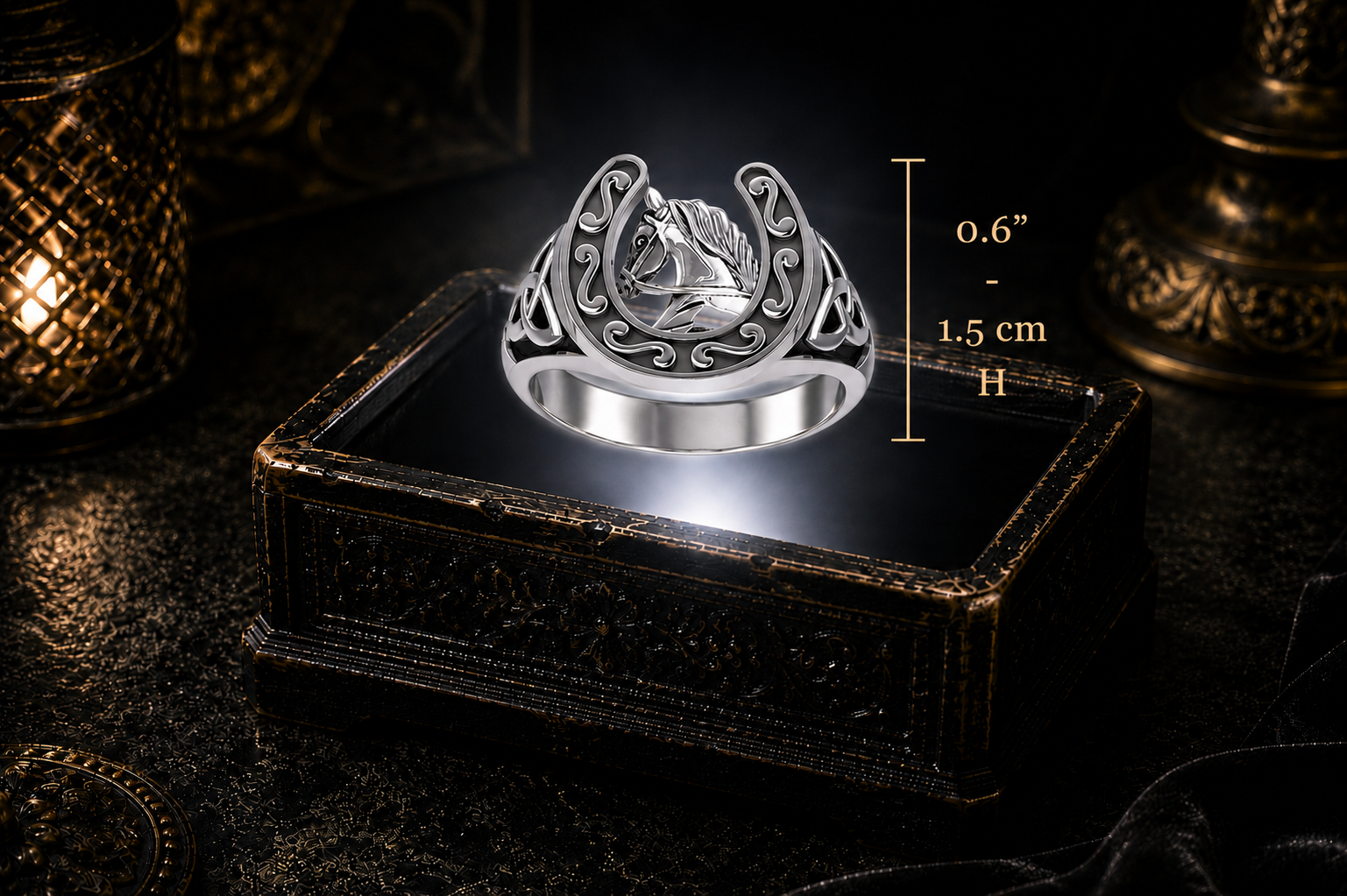 Celtic equestrian horseshoe sterling silver ring with horse head design hovering above an illuminated antique black jewelry box surrounded by candlelight and dark gothic decor