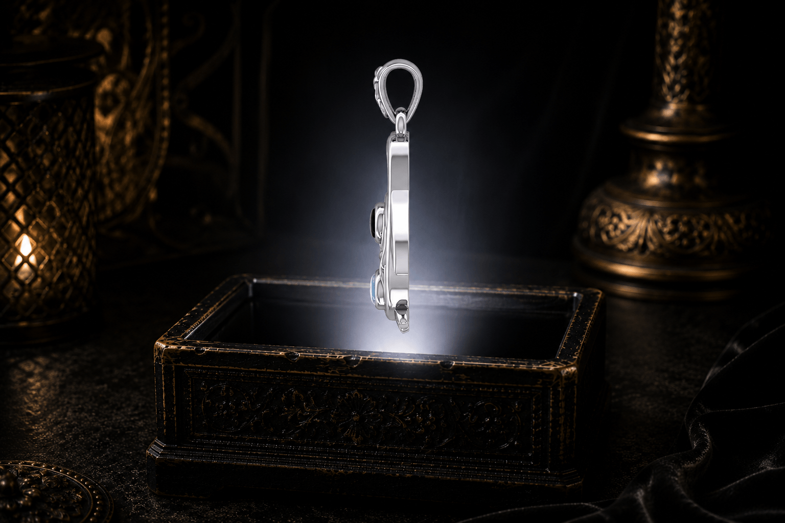 Celtic penguin pendant with black onyx and rainbow moonstone hovering above an ornate antique jewelry box in a white light beam