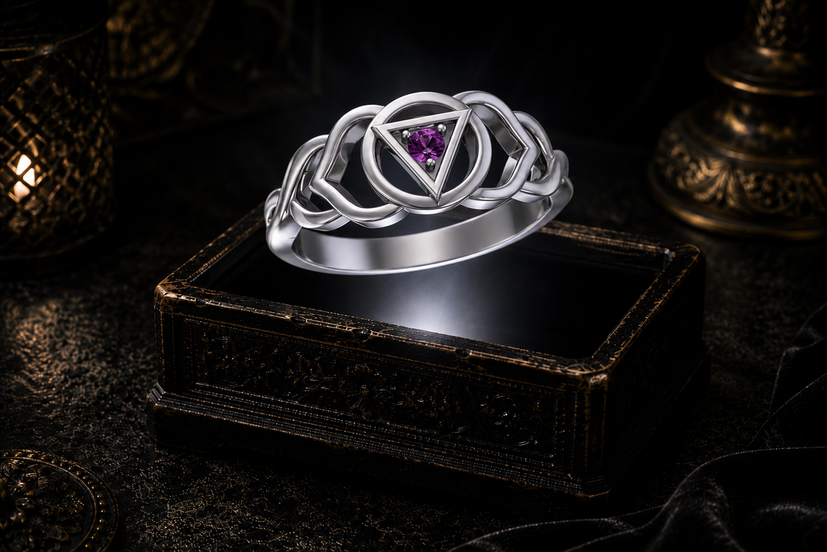 Sterling silver Third Eye chakra Celtic knot ring with amethyst gemstone displayed above an ornate dark jewelry box in a mystical gothic setting.