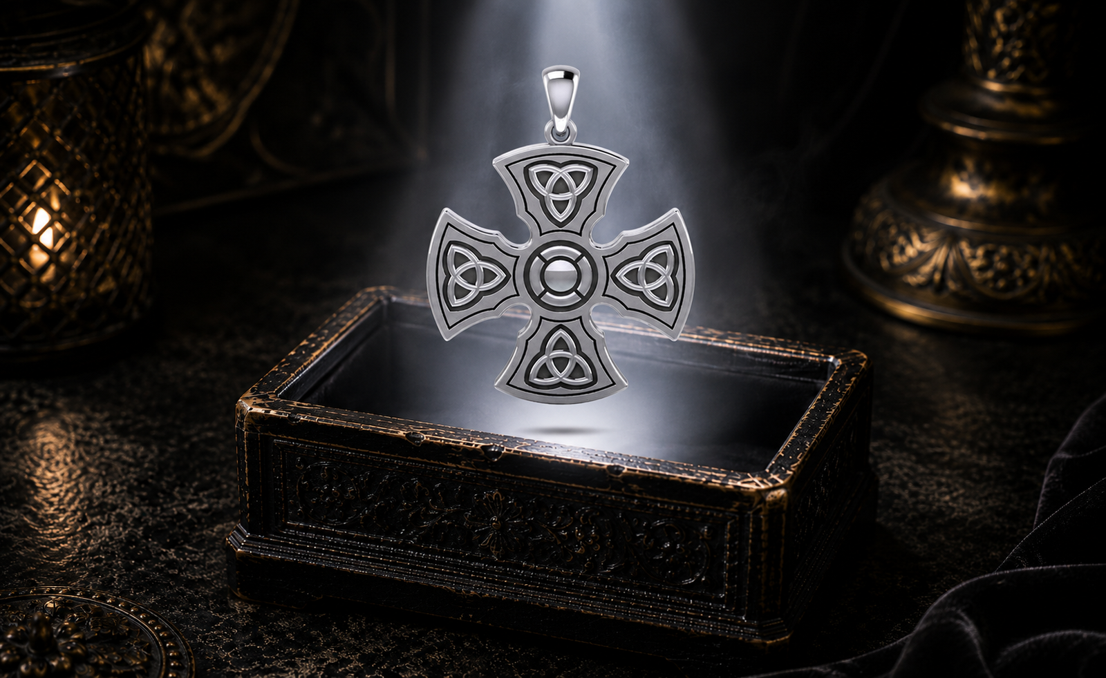 Sterling silver Templar Celtic Cross pendant featuring four Triquetra symbols floating above an ornate jewelry box beneath a radiant beam of light in a dark luxury setting.